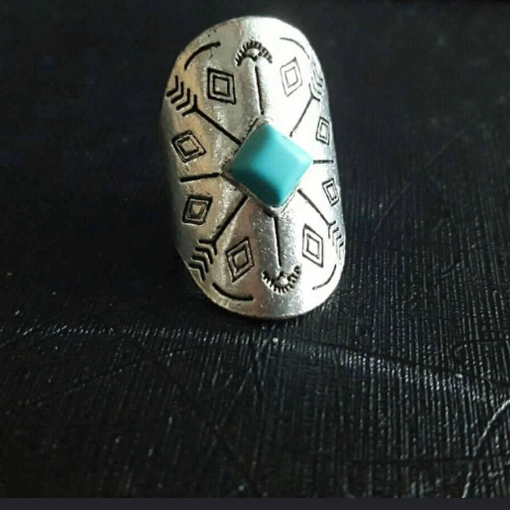 Turquoise-colored stone ring